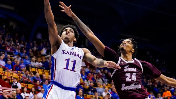 Nov 28, 2022; Lawrence, Kansas, USA; Kansas Jayhawks guard MJ Rice (11) shoots against Texas Southern Tigers forward John Walker III (24) during the second half at Allen Fieldhouse. Mandatory Credit: Jay Biggerstaff-USA TODAY Sports